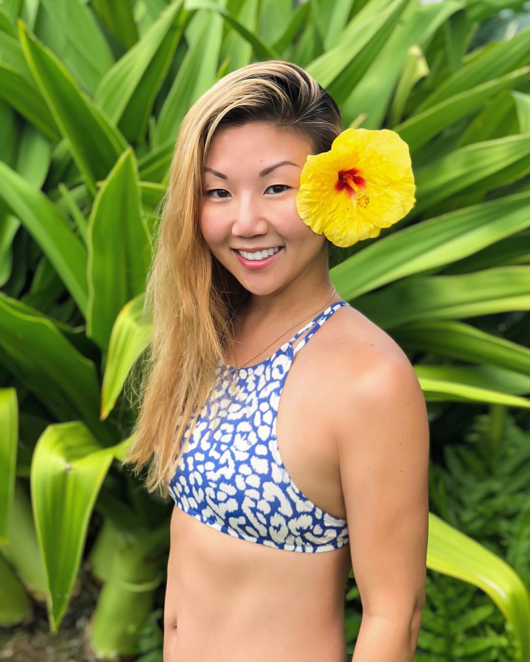 Swept Back Golden Blonde Layers With Floral Accent