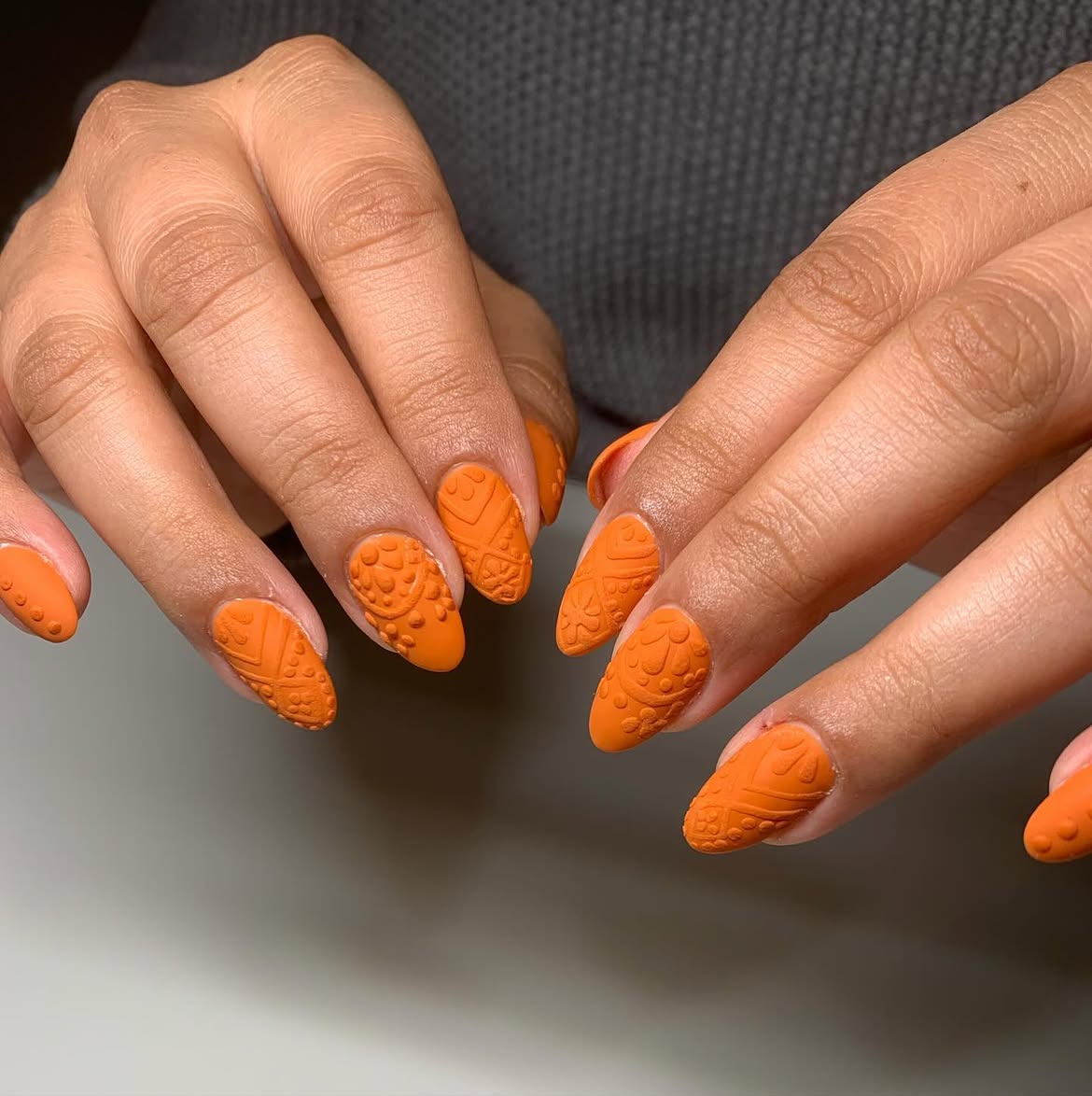 Textured Matte Orange Stamped Almond Nails