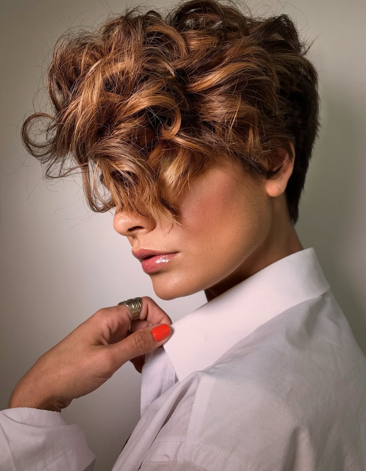 Tousled Auburn Curls With Face-Framing Bangs