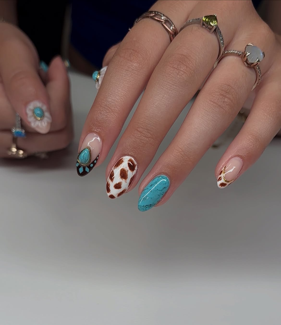 Turquoise Cow Print Oval Nails with Gold Accents