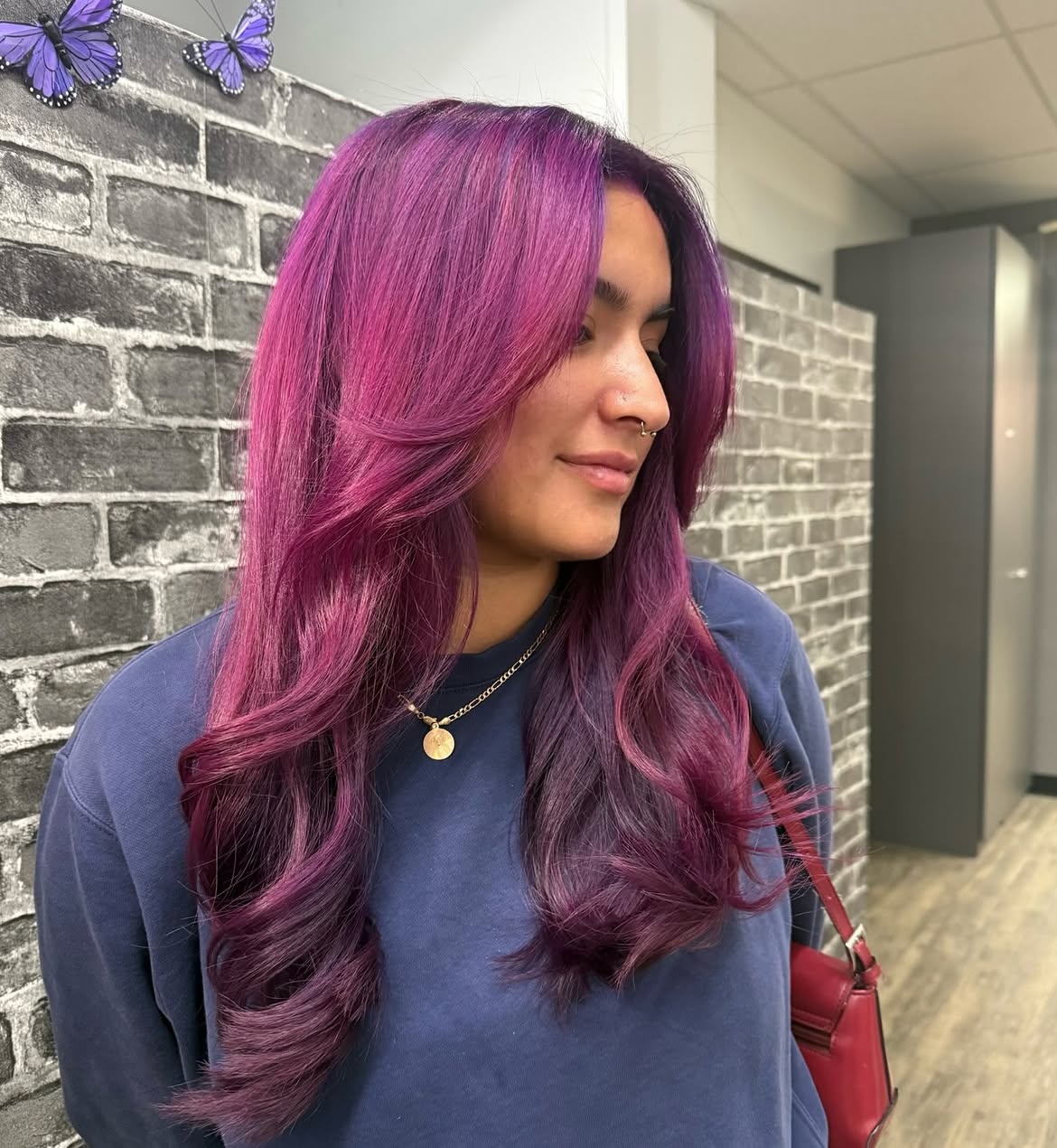 Vibrant Plum Layers With Face Framing Curtain Bangs