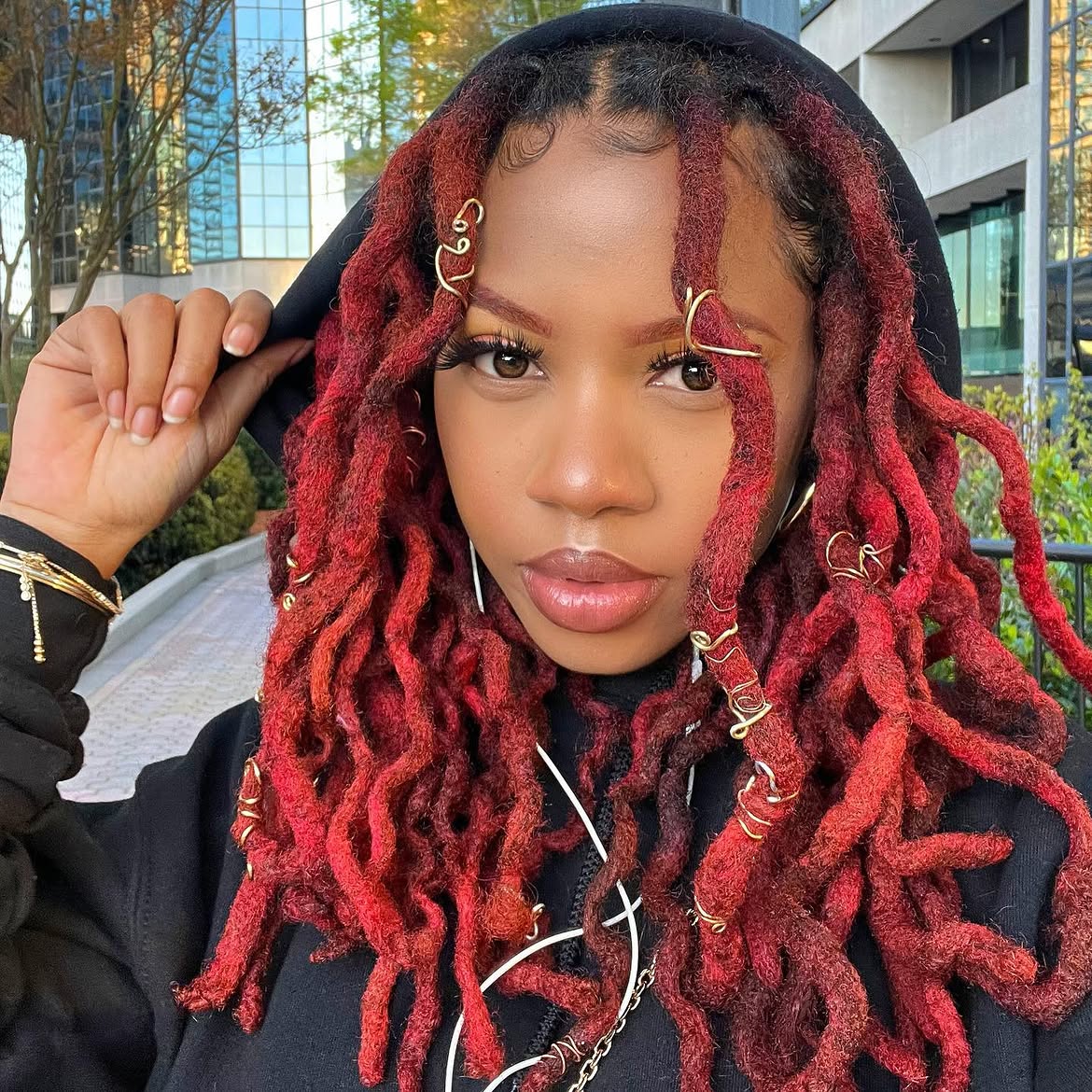 Vibrant Red Locs With Gold Coil Embellishments