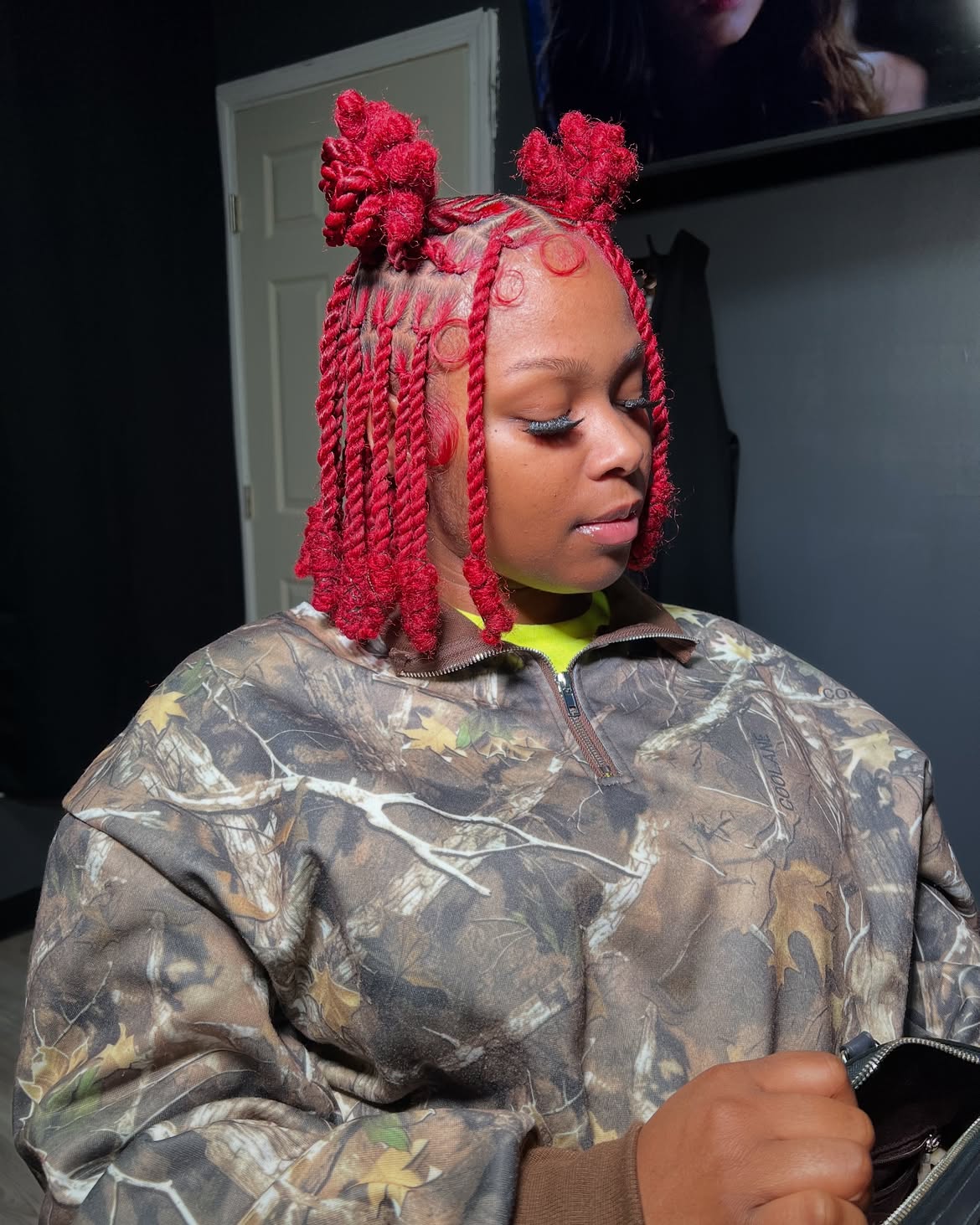 Vibrant Red Twists With Space Buns