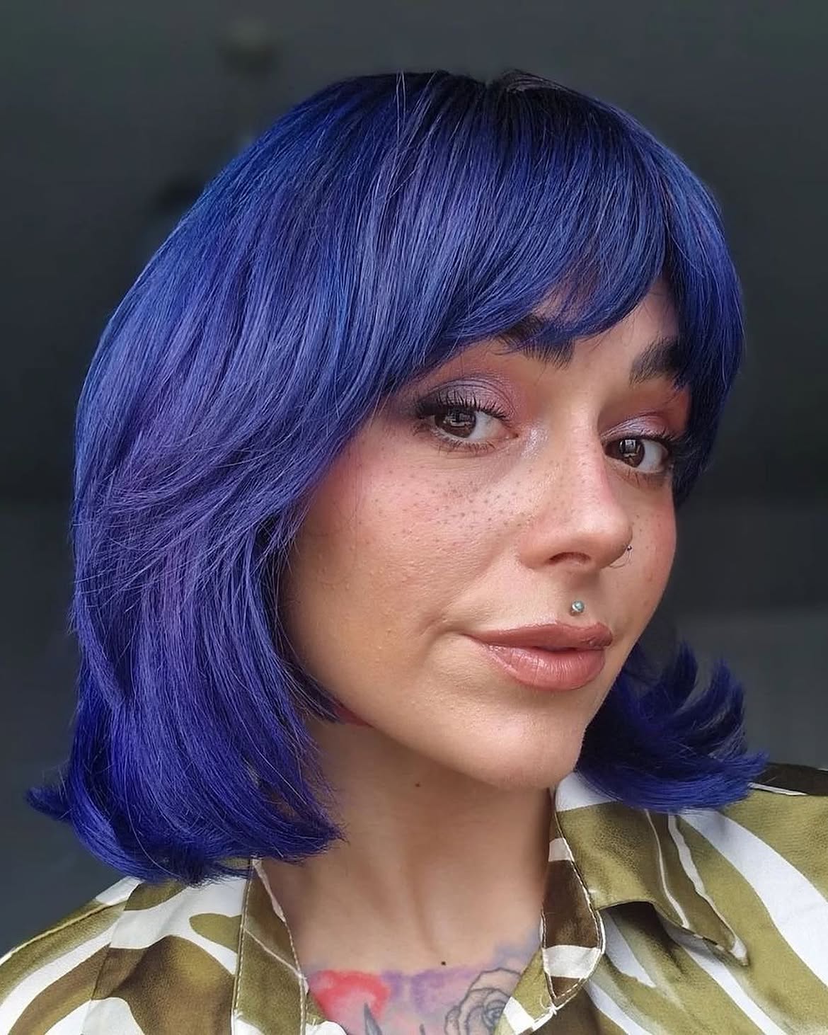 Vibrant Sapphire Blue Bob With Face-Framing Bangs