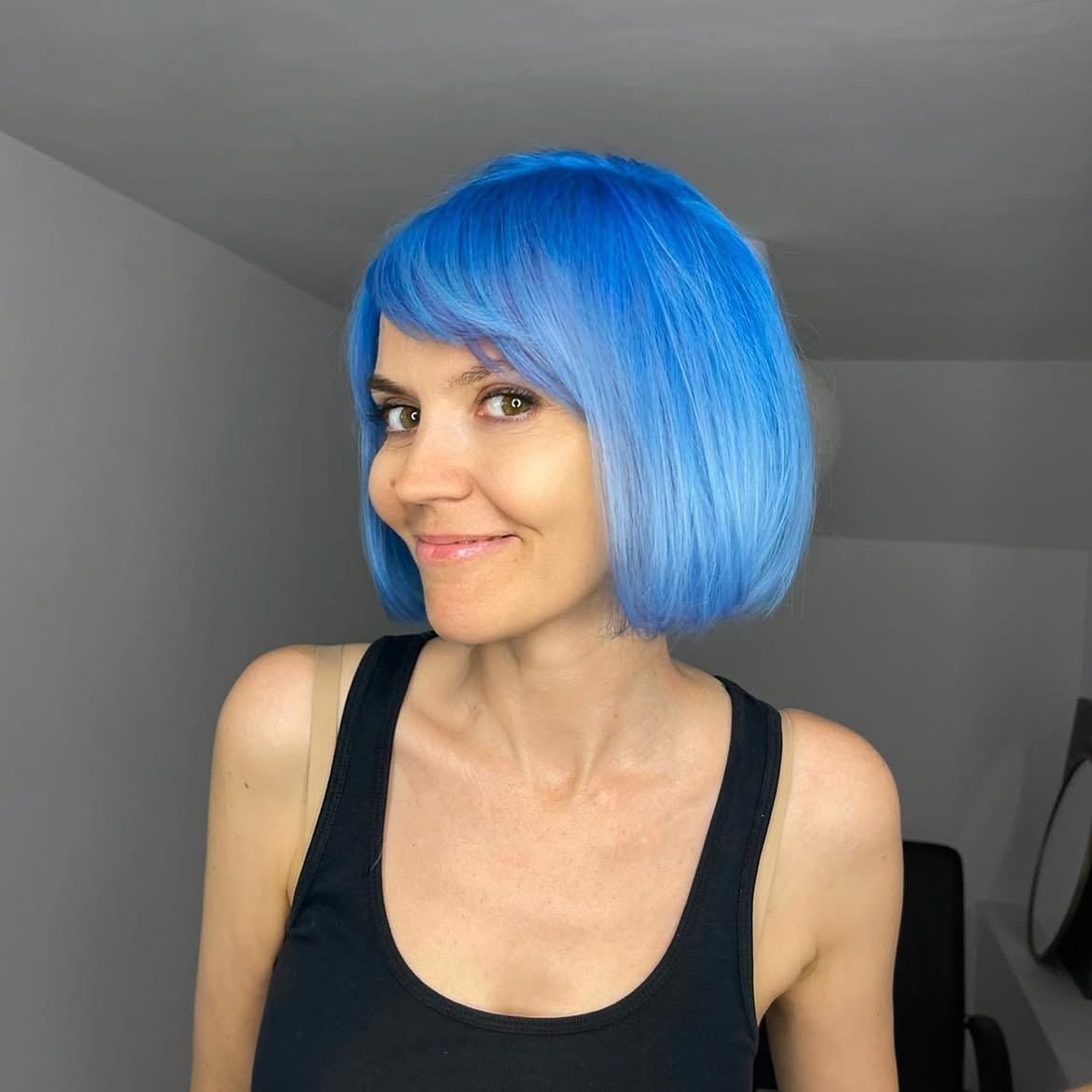 Vivid Electric Blue Bob With Wispy Bangs