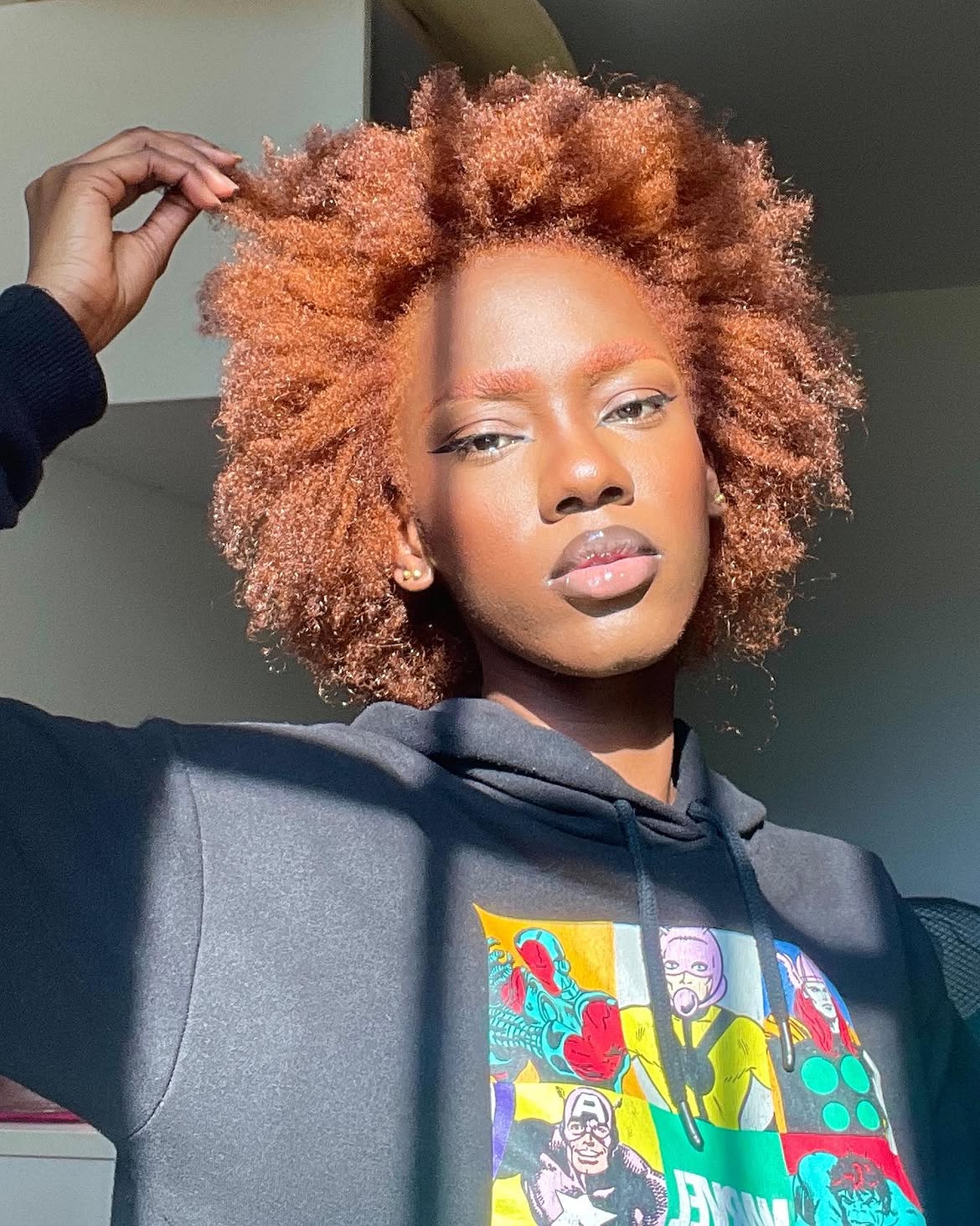 Voluminous Copper Afro With Defined Coily Texture