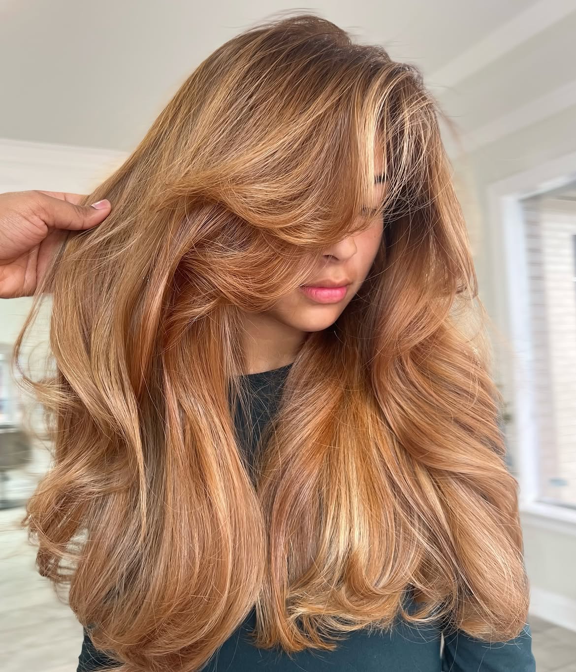 Voluminous Golden Brown Blowout With Face Framing