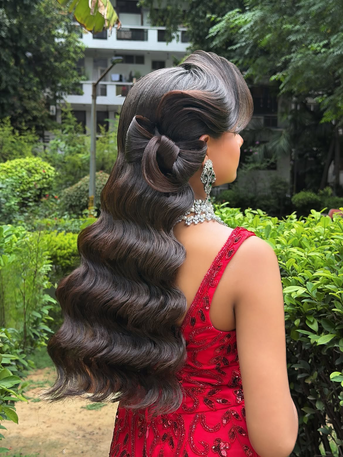 Voluminous Hollywood Waves With Statement Hair Bow