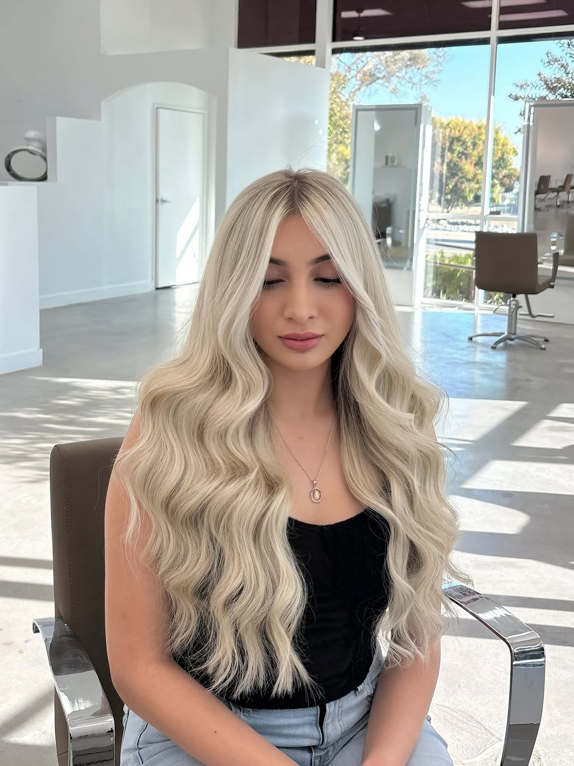 Voluminous Platinum Blonde Waves With Face-Framing Layers