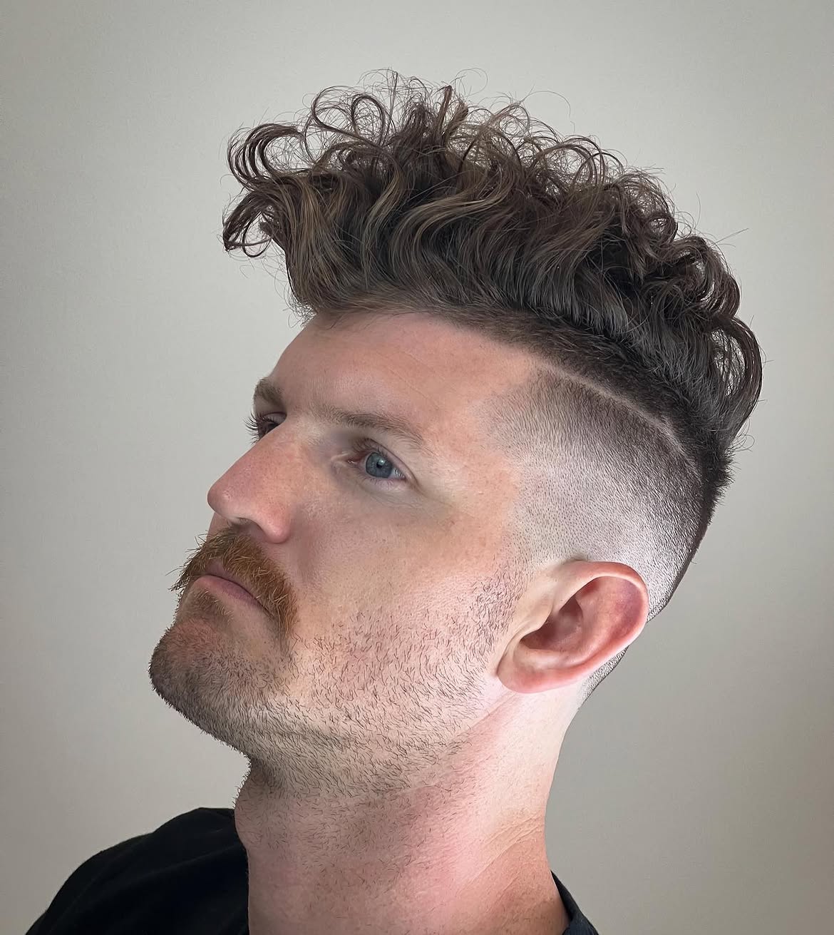 Voluminous Textured Curls With Undercut Fade