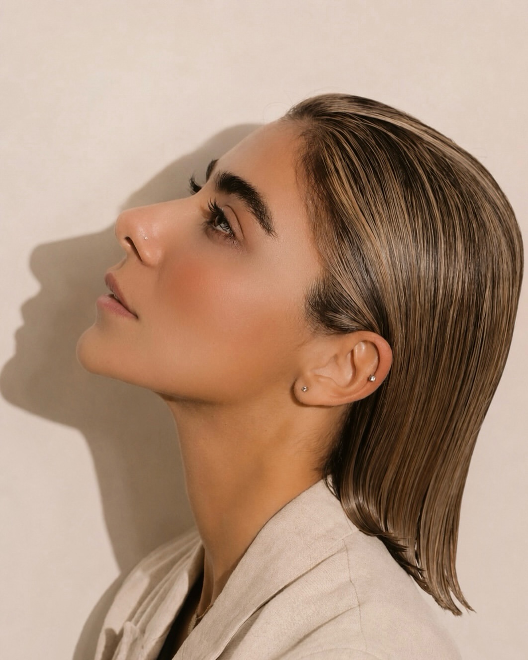 Wet Look Sleek Lob With Golden Blonde Highlights