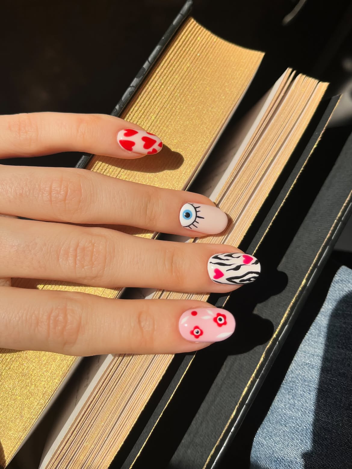 Whimsical Mismatched Heart And Eye Motif Nails
