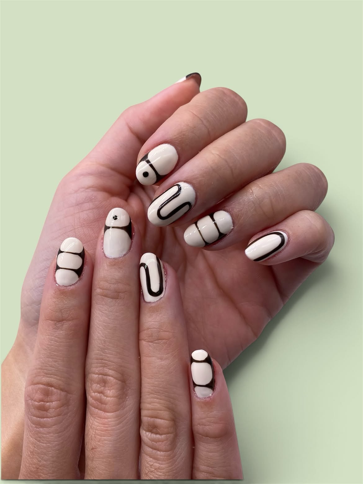 Abstract Black Line Art Cream Oval Nails