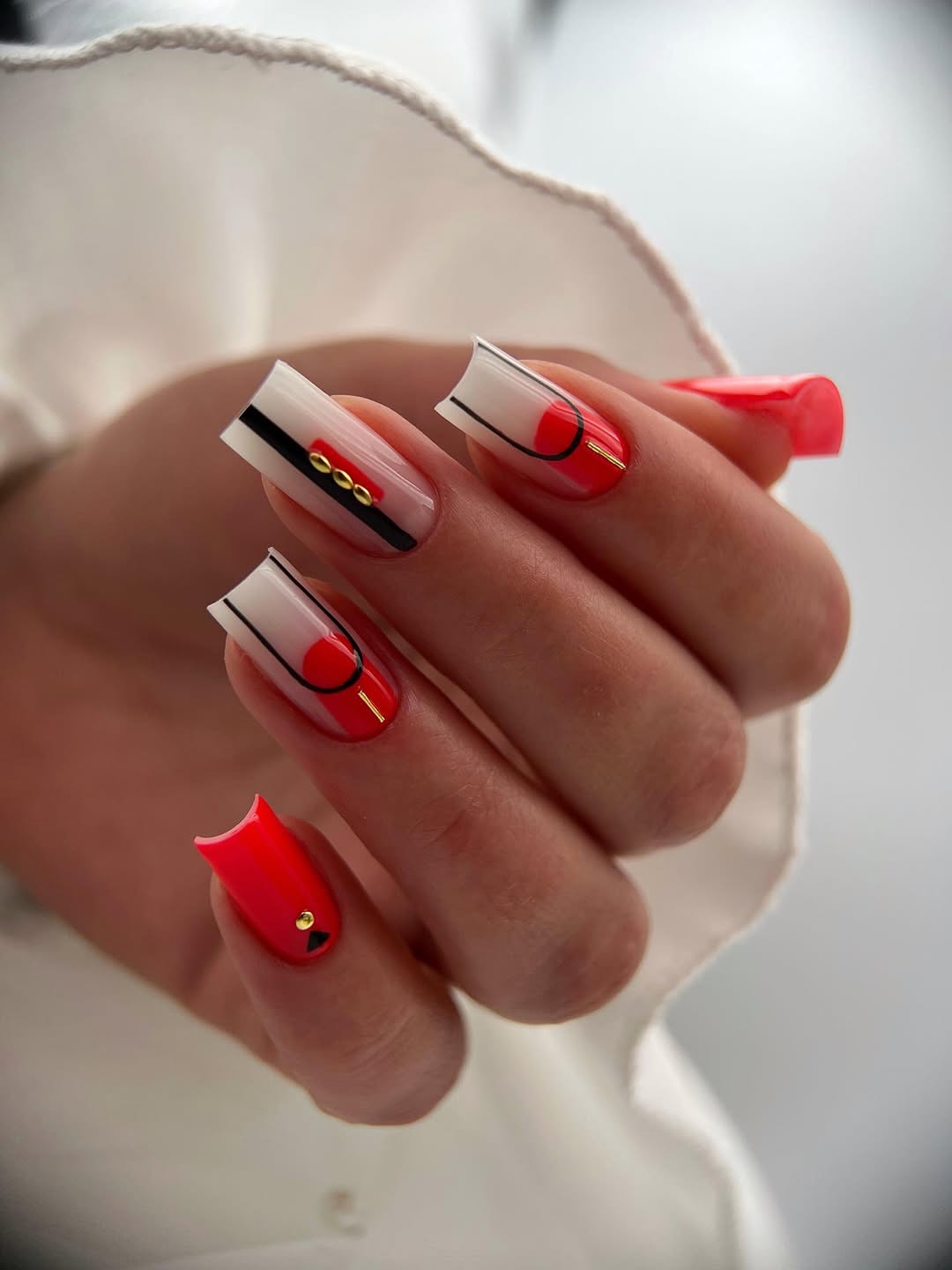 Abstract Geometric Coral French Tips with Gold Accents