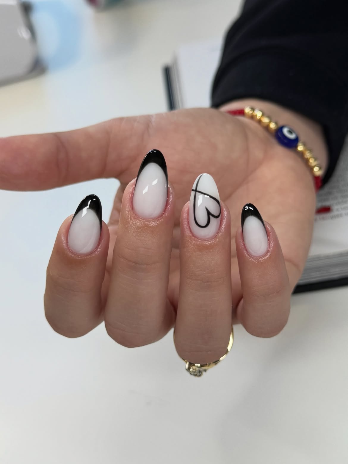 Black French Tip Almond Nails with Heart Art