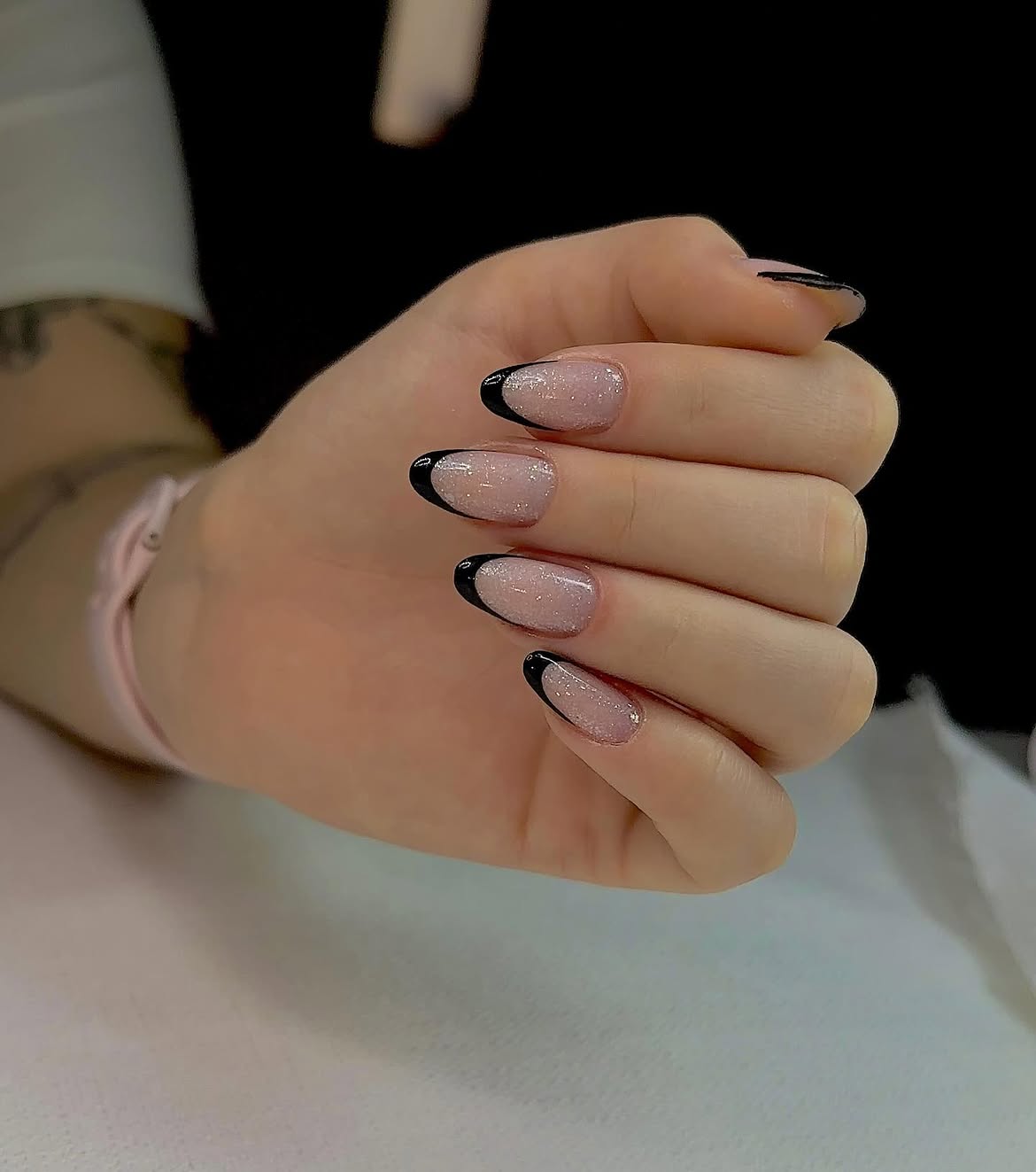 Black French Tip Oval Nails With Glitter Overlay