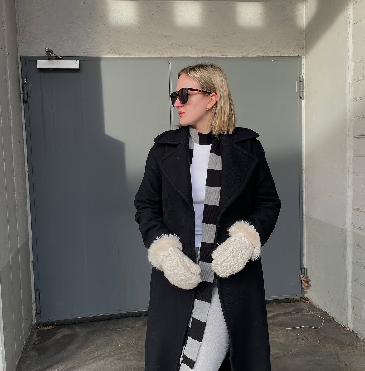 Black Wool Coat With Striped Scarf And Mittens