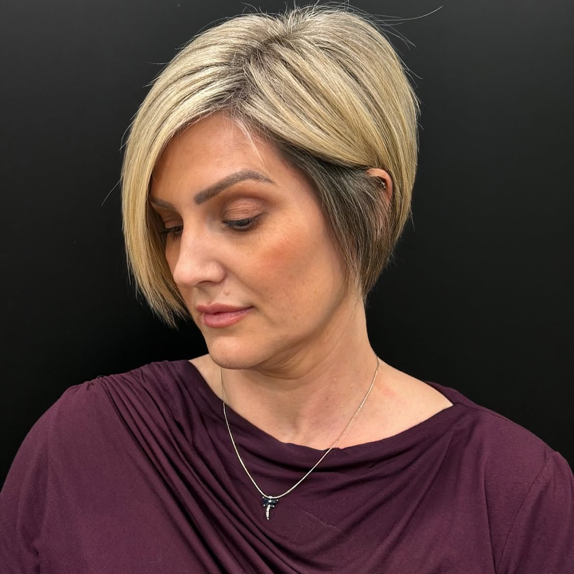 Blonde Bob With Deep Side Part and Subtle Ash