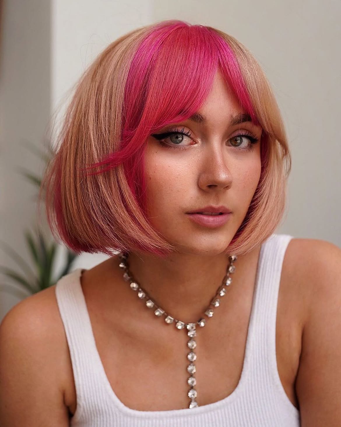 Blunt French Bob With Pink Face Framing Highlights