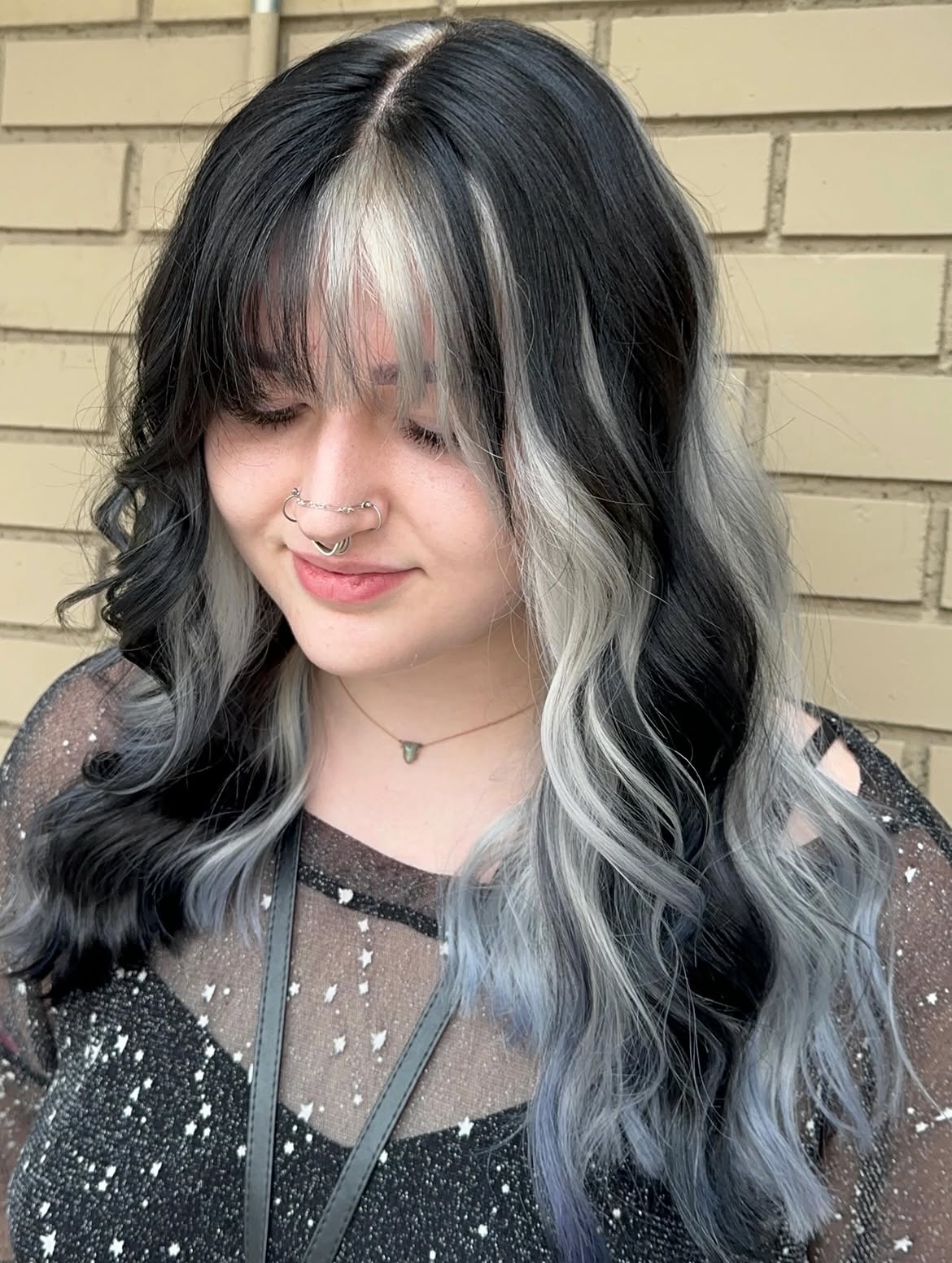 Bold Skunk Stripe Hair With Wavy Layers