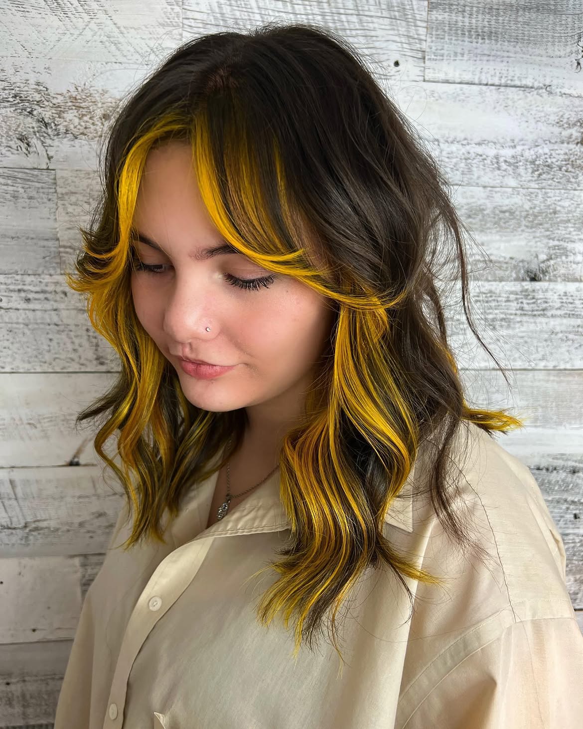 Bold Yellow Face Framing Highlights On Dark Waves
