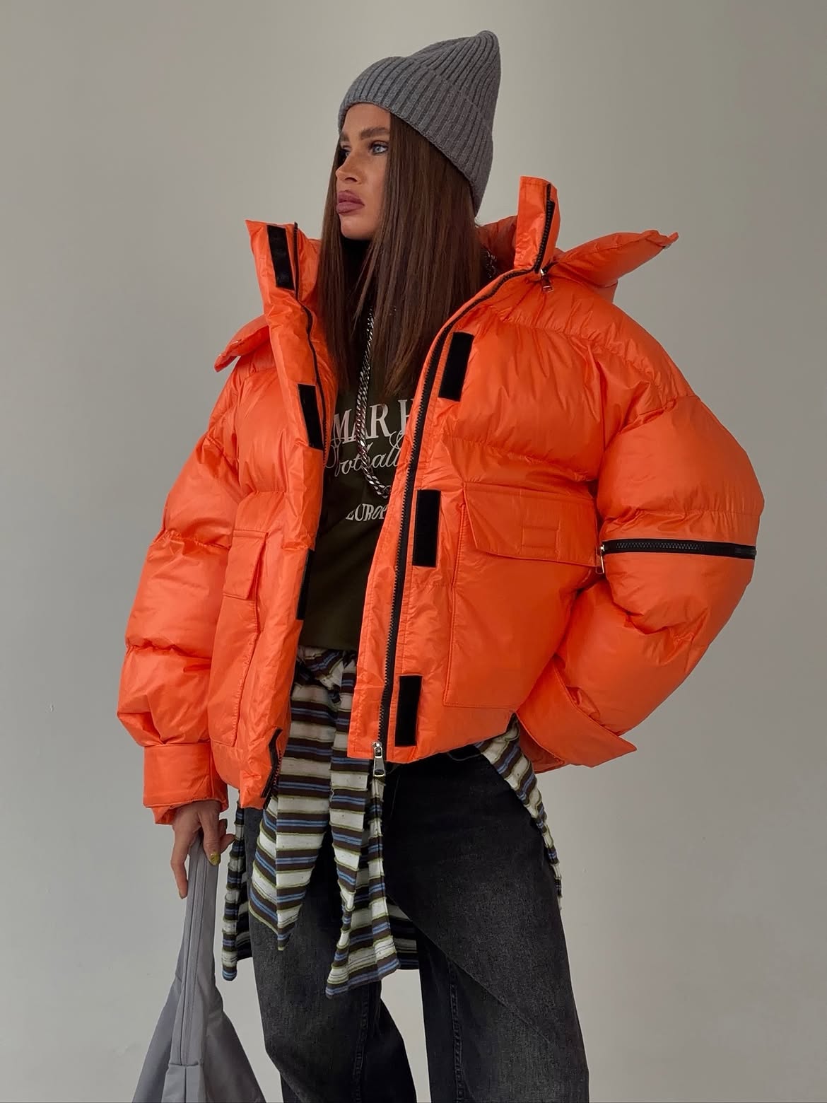 Bright Orange Puffer Jacket With Layered Streetwear Style