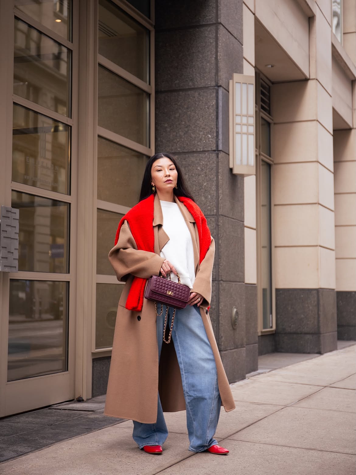 Camel Coat With Wide Leg Jeans And Red Accents