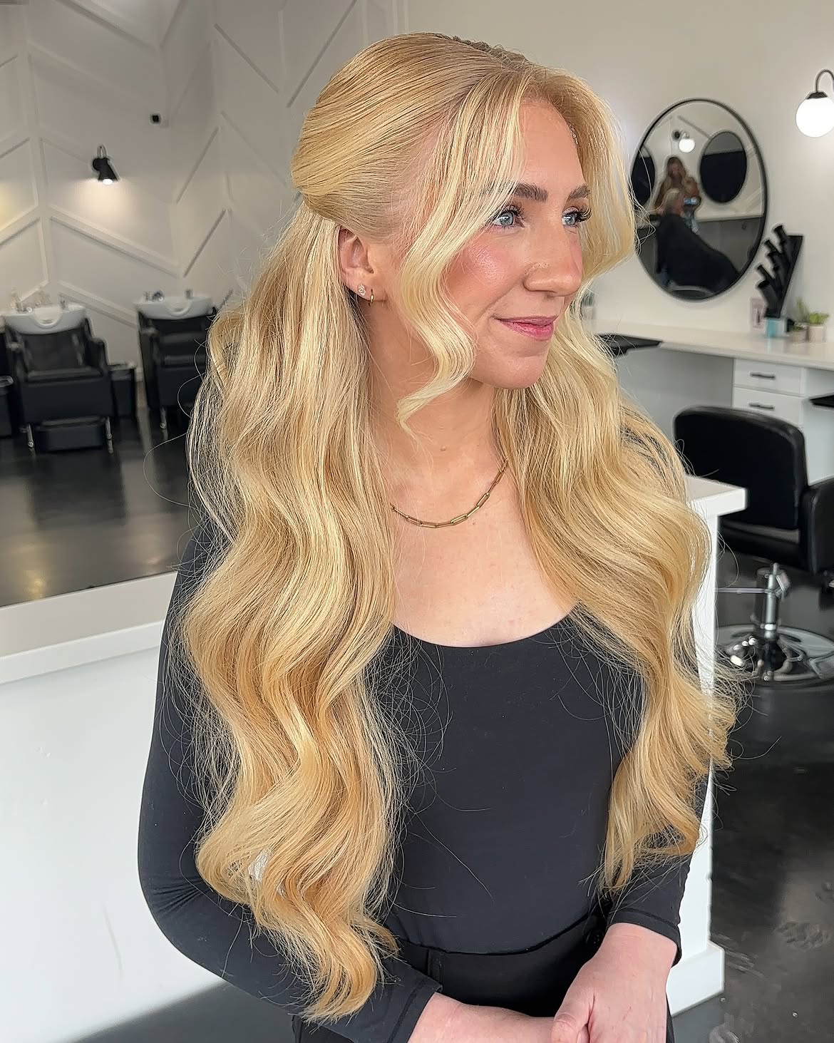 Cascading Honey Blonde Waves With Half-Up Style