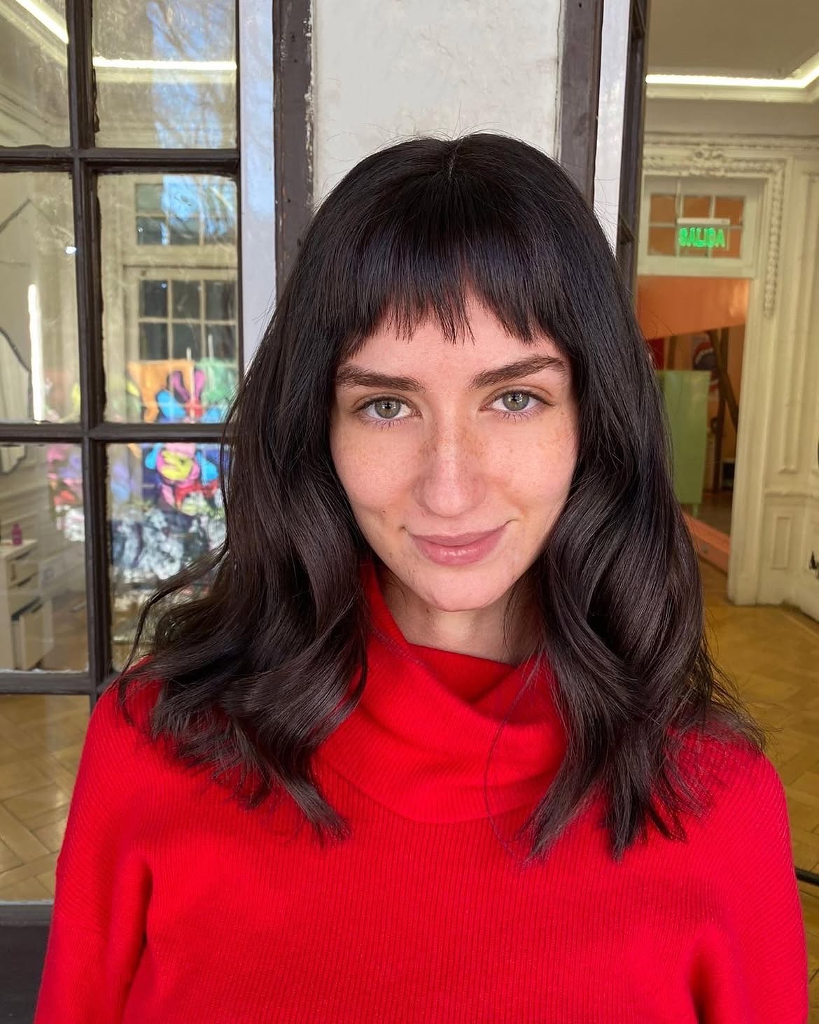 Chic Baby Bangs With Dark Wavy Lob