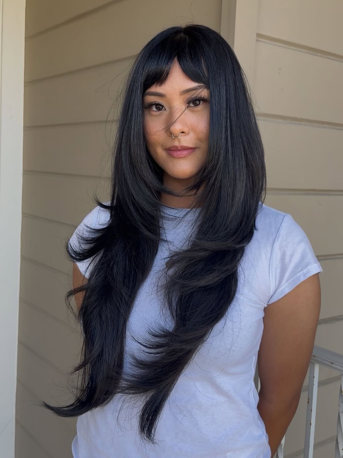 Chic Layered Cut With Bold Baby Bangs
