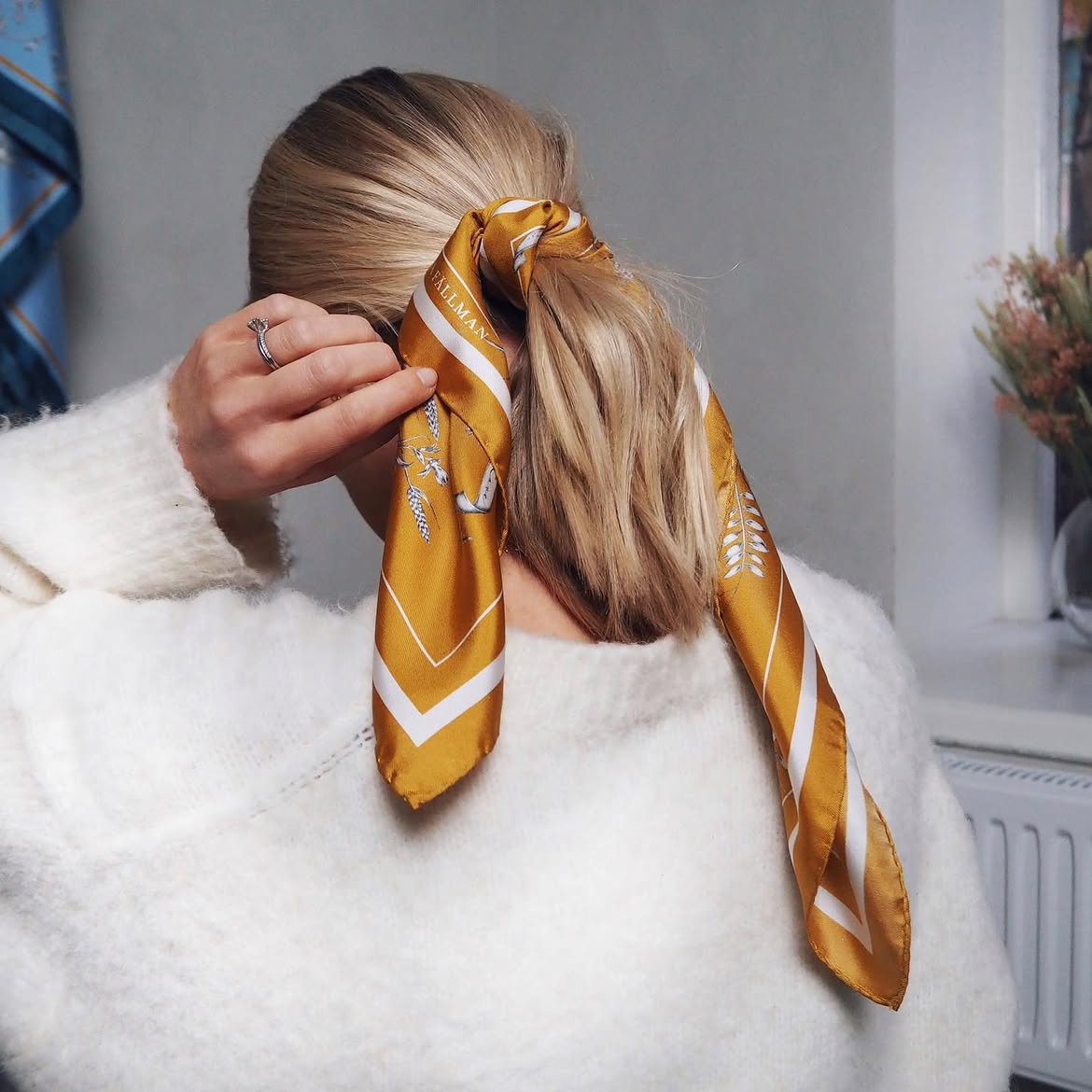 Chic Ponytail With Golden Silk Scarf Accent