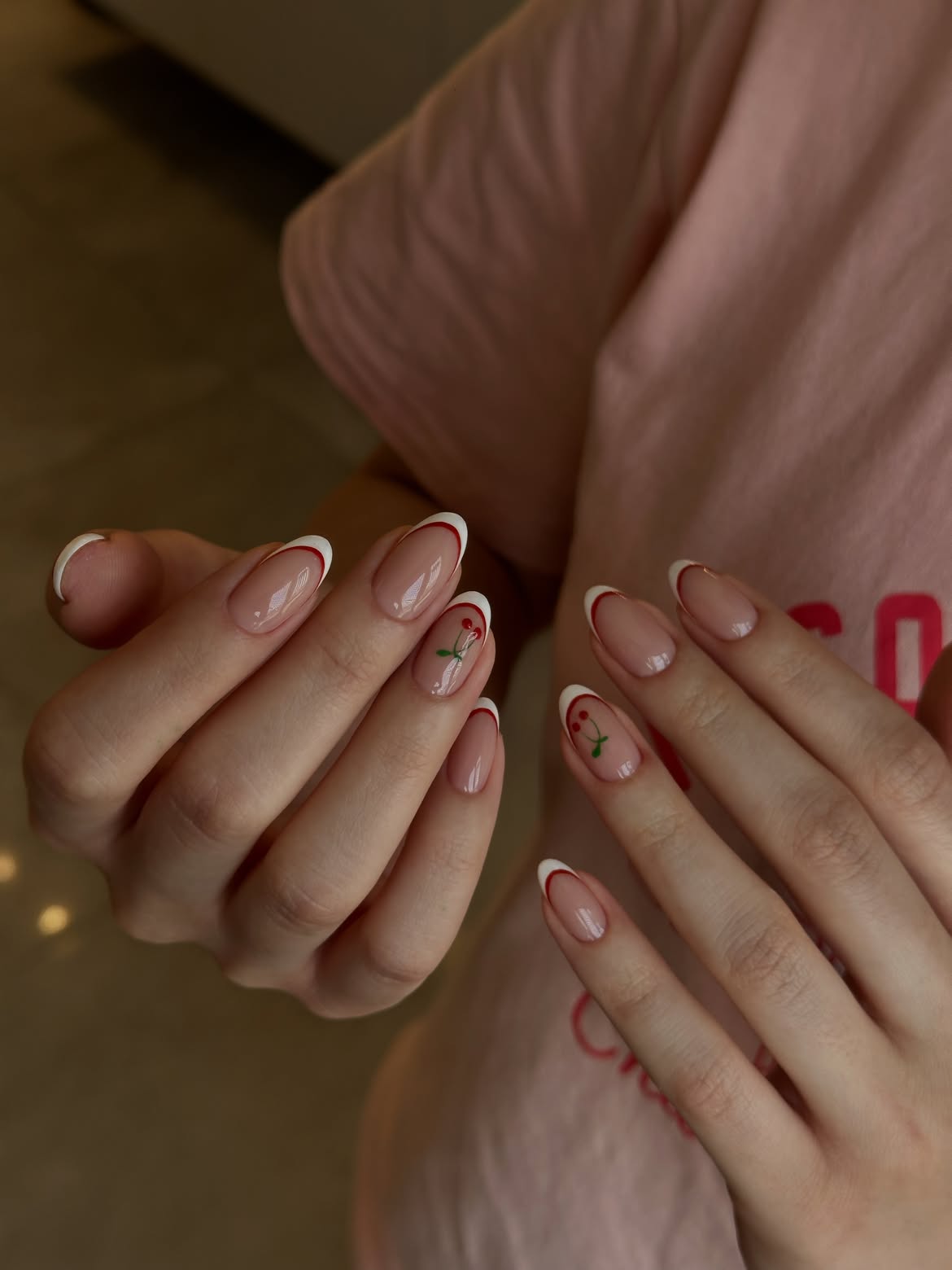 Classic French Tips with Cherry Accent Nail Art