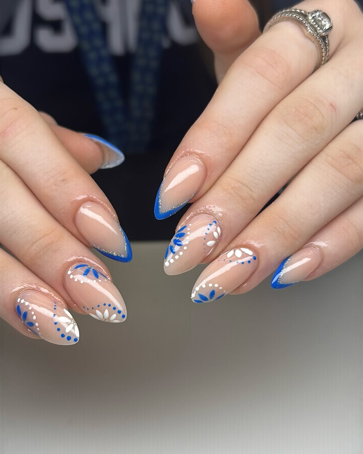 Cobalt Blue French Tip Almond Nails with Daisy Art