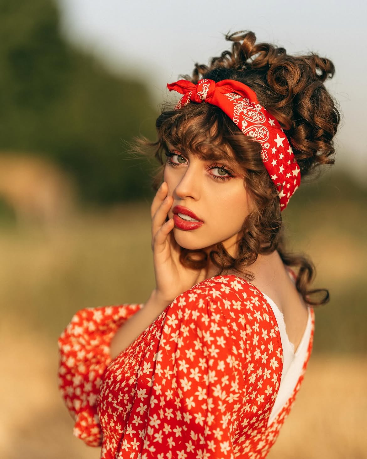 Curly Updo With Red Bandana And Wispy Bangs