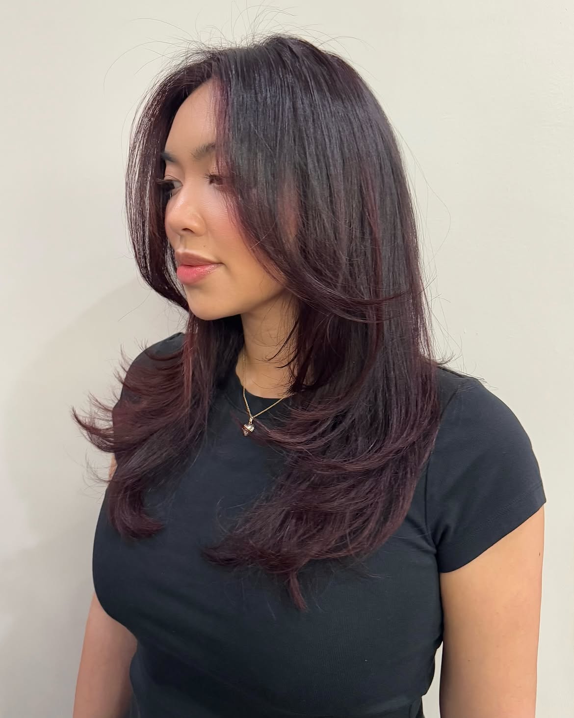 Dark Cherry Layers With Face Framing Bangs