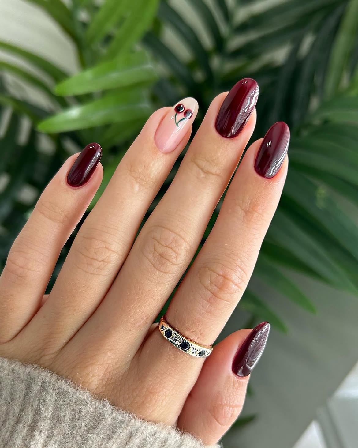 Deep Burgundy Almond Nails with Cherry Accent