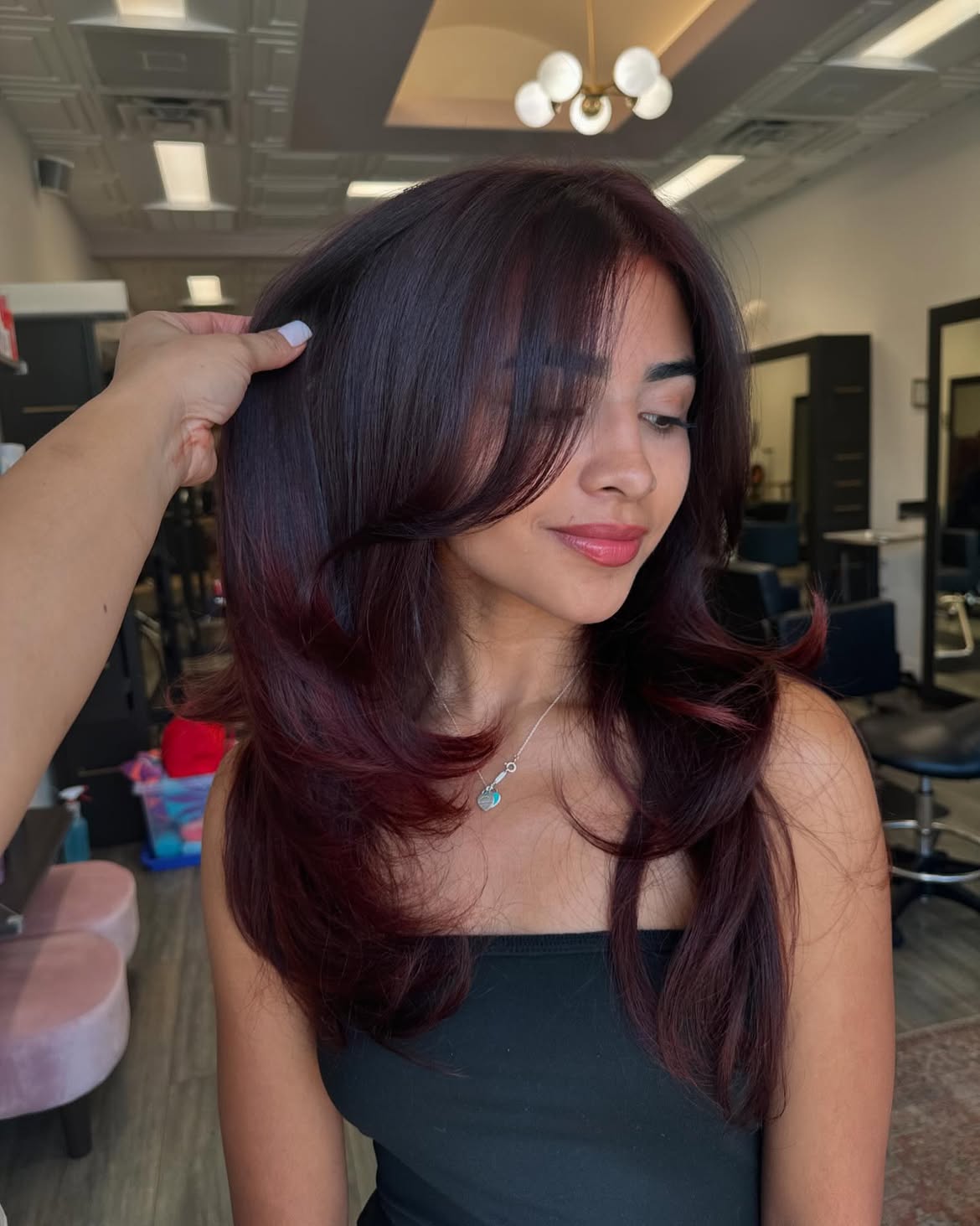 Deep Cherry Red Layers With Face Framing Bangs