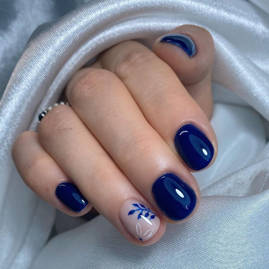 Deep Navy Blue Oval Nails with Floral Accent