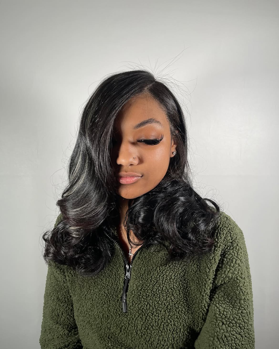 Deep Side Part Voluminous Curls With Face Framing