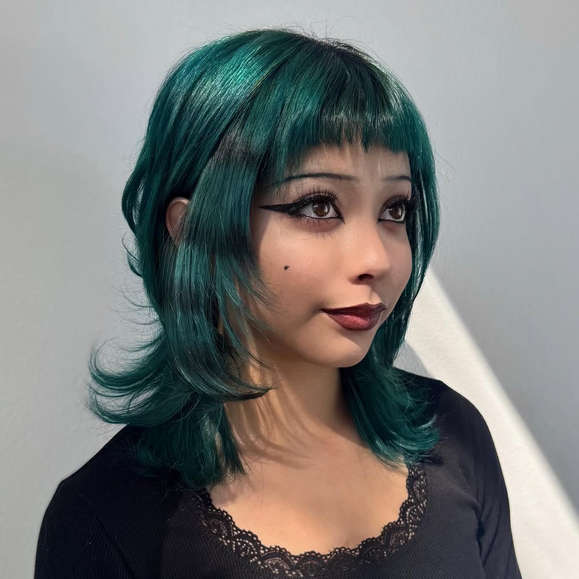 Deep Teal Shag With Wispy Bangs