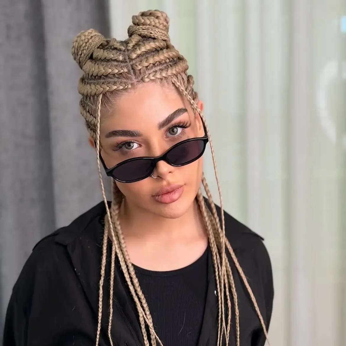 Double Space Buns With Braided Strands