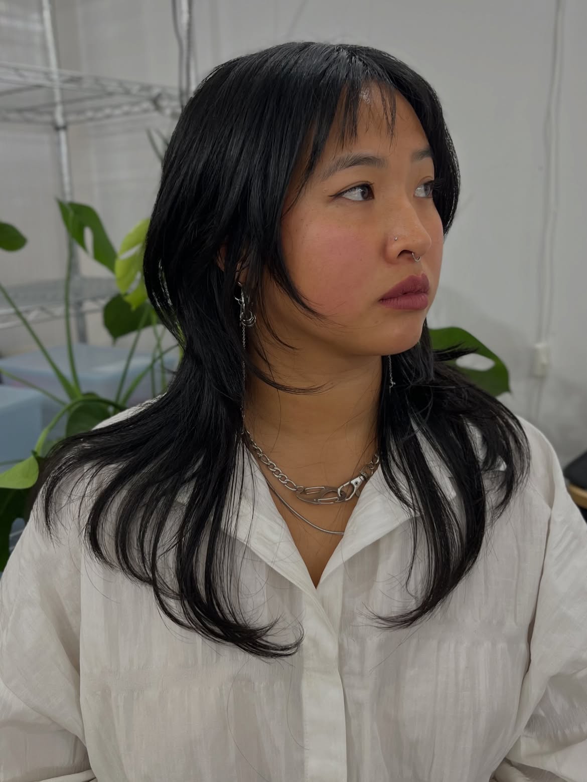 Edgy Layered Cut With Wispy Bangs And Subtle Waves