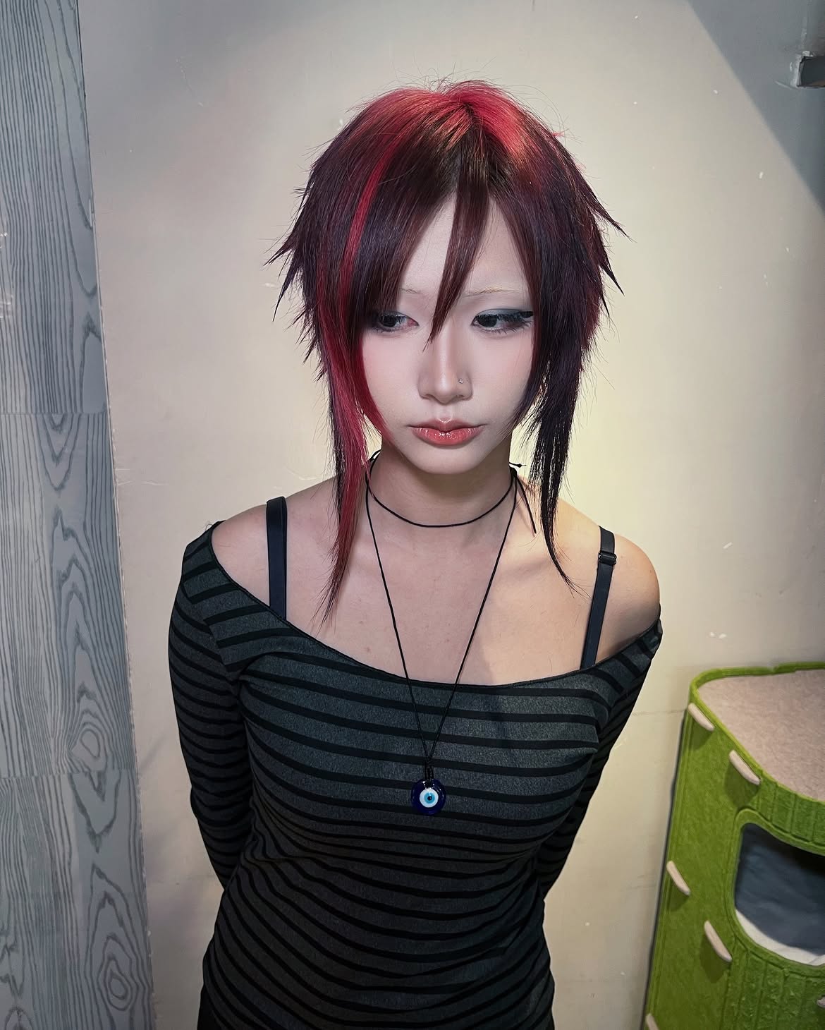 Edgy Layered Spiky Wolf Cut With Crimson Highlights