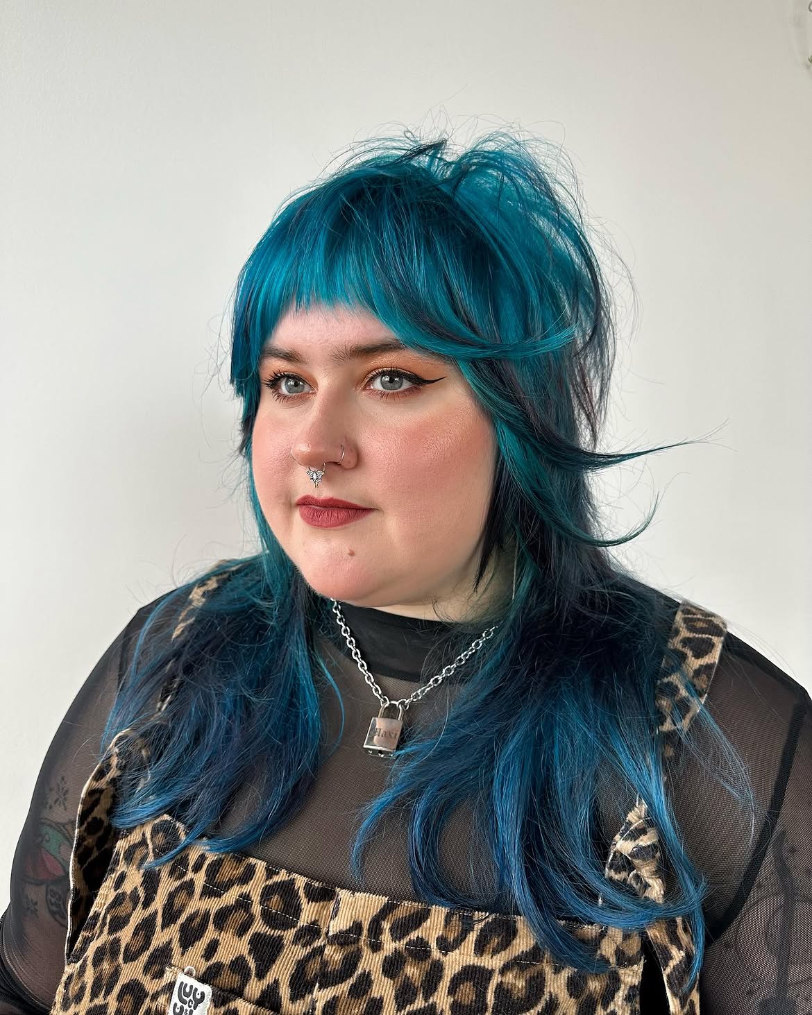 Edgy Teal Shag With Choppy Bangs