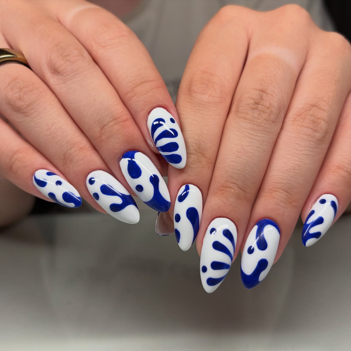 Glossy Blue Organic Swirl Almond Nails