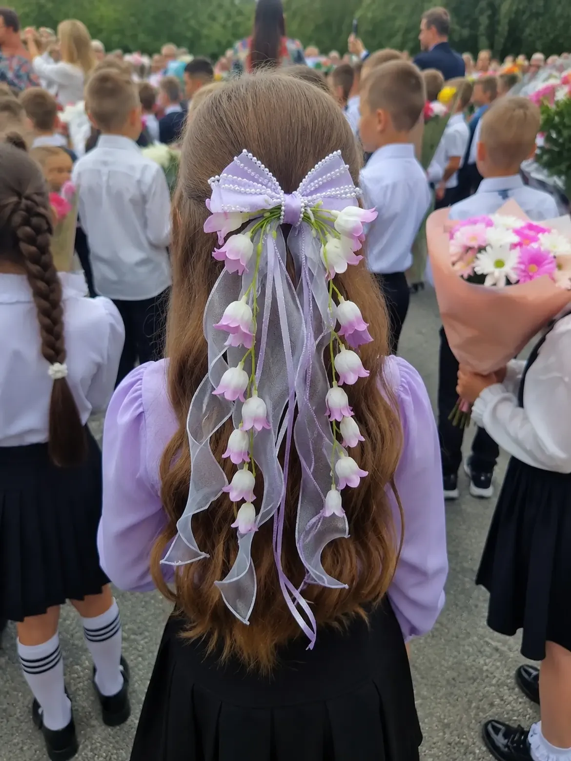 Half Up Hairstyle With Decorative Floral Bow