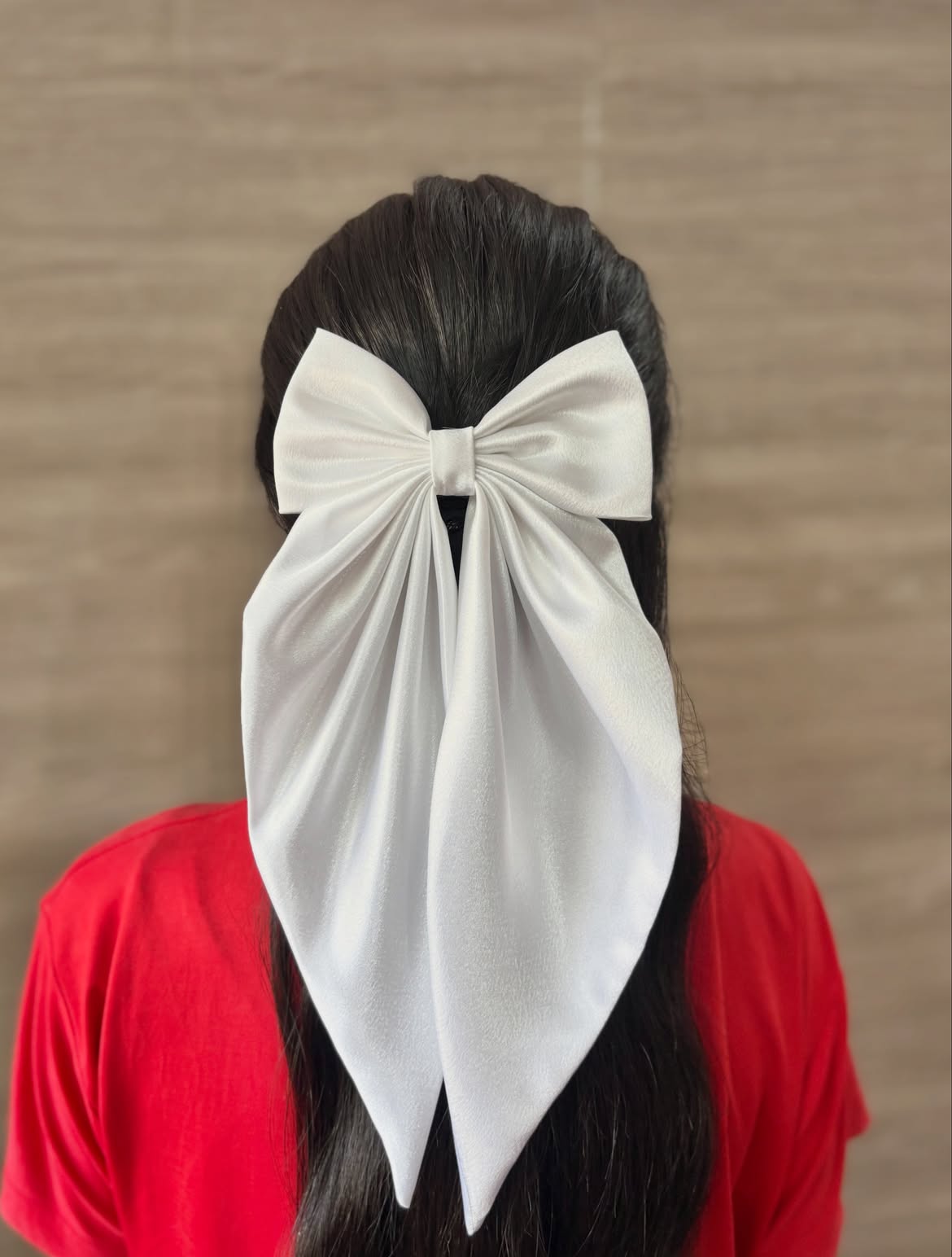 Half Up Satin Bow On Long Dark Hair