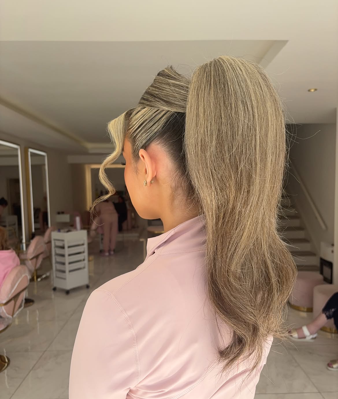 High Sleek Ponytail With Face Framing Waves