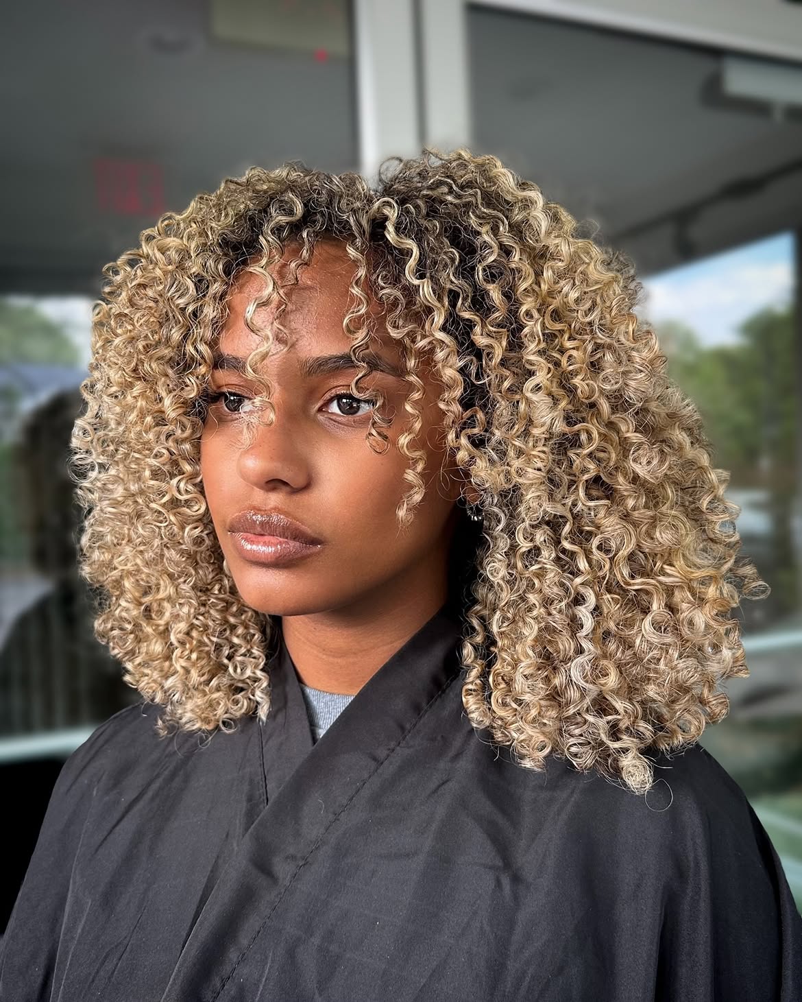 Honey Blonde Curls With Face-Framing Layers