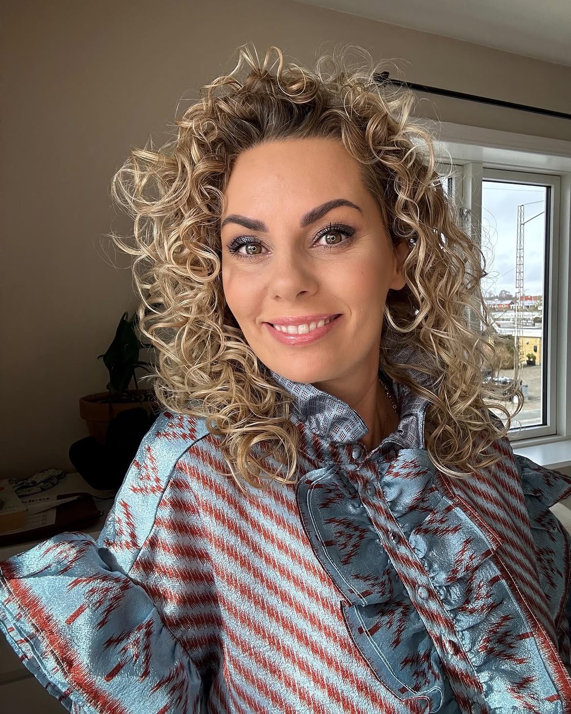 Honey Blonde Spring Curls With Face Framing